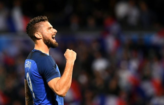 France's forward Olivier Giroud celebrates his goal during the friendly football match bet