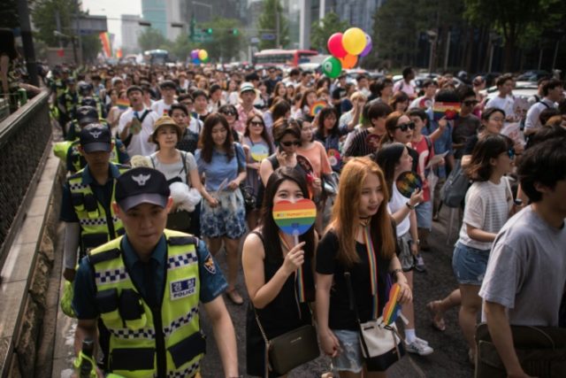 Participants march during a Gay Pride parade in Seoul on June 11, 2016