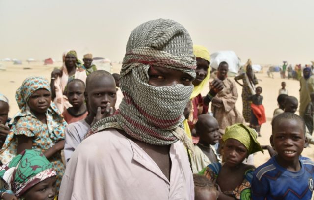 A boy looks on in a camp in the village of Kidjendi near Niger's Diffa after displaced fam