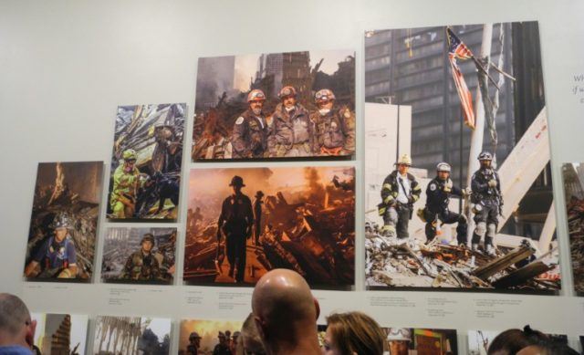 Visitors look at the "Hope at Ground Zero" exhibit at the 9/11 Memorial Museum's south tow