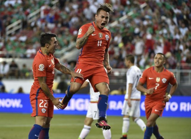 Chile's Eduardo Vargas (C) celebrates after scoring against Mexico during the Copa America