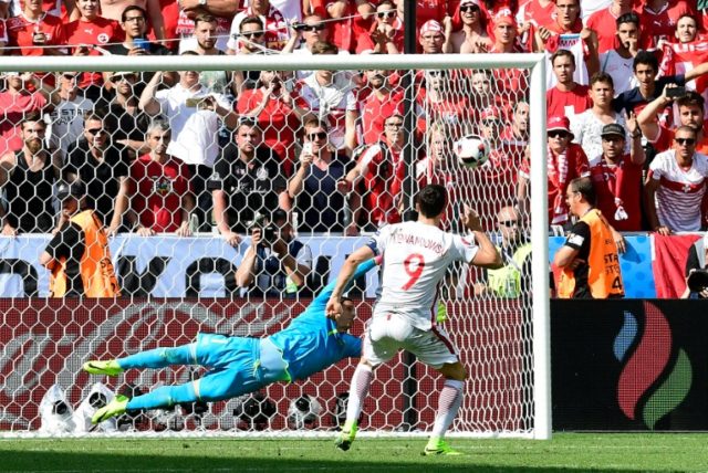 Poland striker Robert Lewandowski scores his penalty during the Euro 2016 round of sixteen