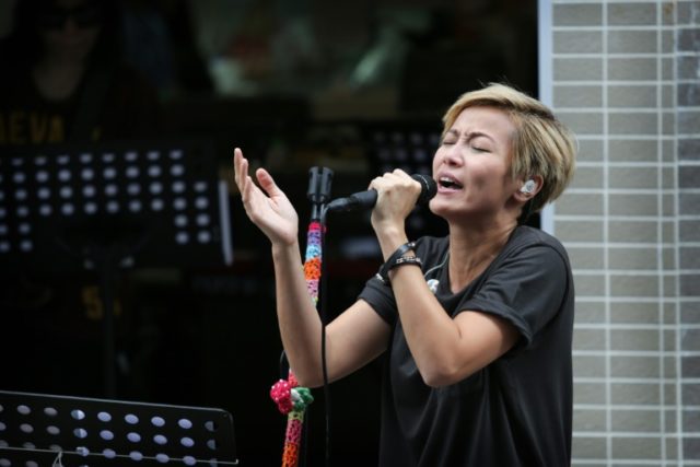 Singer Denise Ho performs at a free concert in Hong Kong on June 19, 2016, staged despite