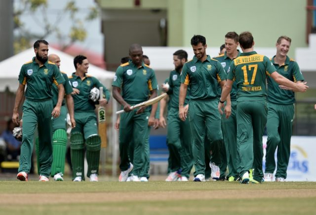 The South African team walks onto the field during the first One-day International cricket