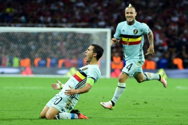 Belgium's forward Eden Hazard (L) celebrates after scoring his team's third goal against H