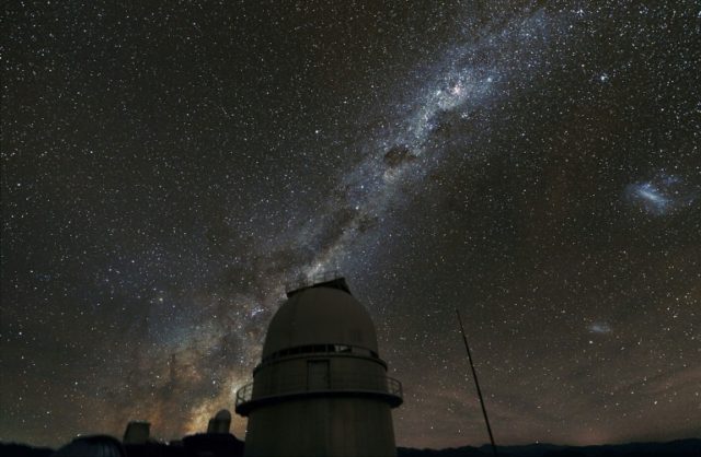 The Milky Way galaxy illuminates the sky above the dome of a telescope at European Souther