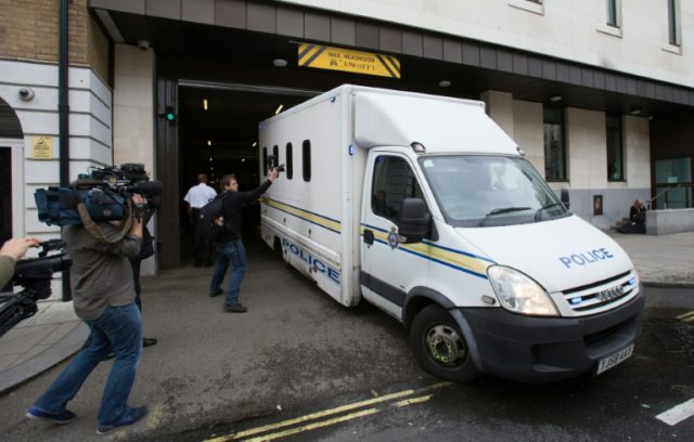 A prison van is driven out of Westminster Magistrates Court in central London, on June 18,