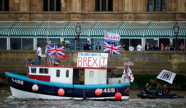 A flotilla of boats sails down the River Thames in London campaigning for a 'leave' vote i