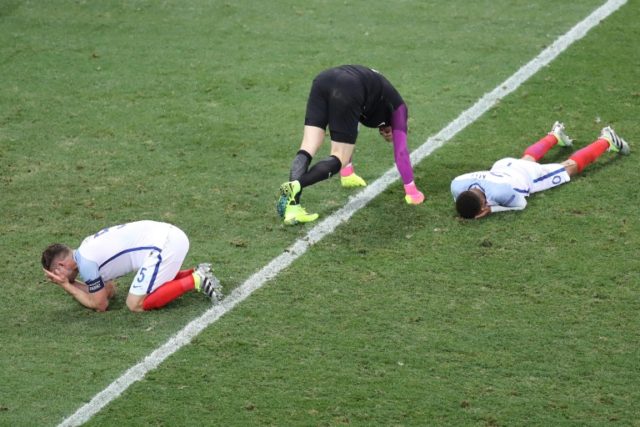 (From L) England's Gary Cahill, Joe Hart and Dele Alli react after their Euro 2016 round o