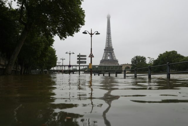 A picture taken on June 2, 2016 shows the river Seine bursting its banks next to the Eiffe