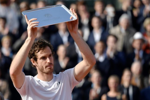 Britain's Andy Murray holds his trophy after coming in second at the French Open on June 5