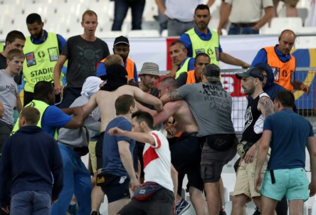Supporters fight at the end of the Euro 2016 match between England and Russia at the Stade Velodrome in Marseille, on June 11, 2016
