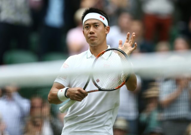 Japan's Kei Nishikori celebrates after beating France's Julien Benneteau in their second r