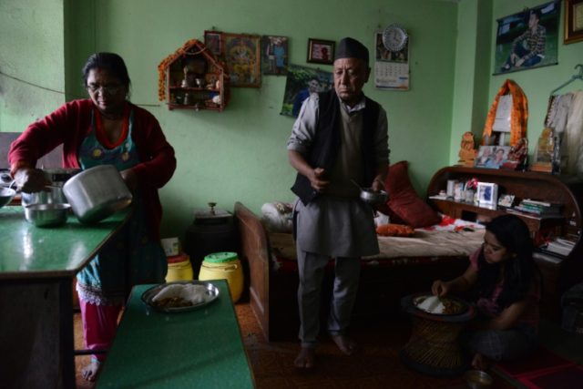 Nepalese woman Suntali Rasaili (L), whose teenage daughter was allegedly executed by Nepal
