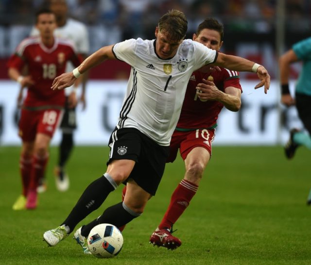 Germany's midfielder Bastian Schweinsteiger (L) played the last 23 minutes in Gelsenkirche