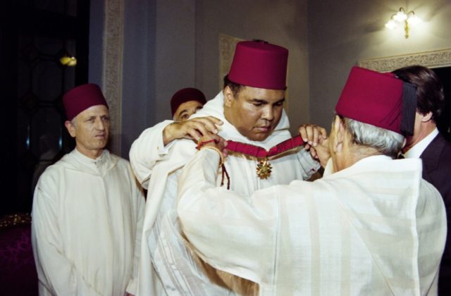 Moroccan King Hassan II (R) decorating Muhammad Ali during a ceremony in the Royal Palace