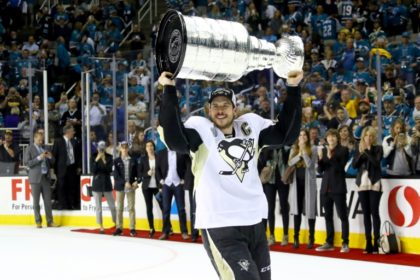 Sidney Crosby of the Pittsburgh Penguins celebrates with the Stanley Cup after their 3-1 victory against the San Jose Sharks in Game Six of the 2016 NHL Stanley Cup Finals, at SAP Center in San Jose, California, on June 12, 2016