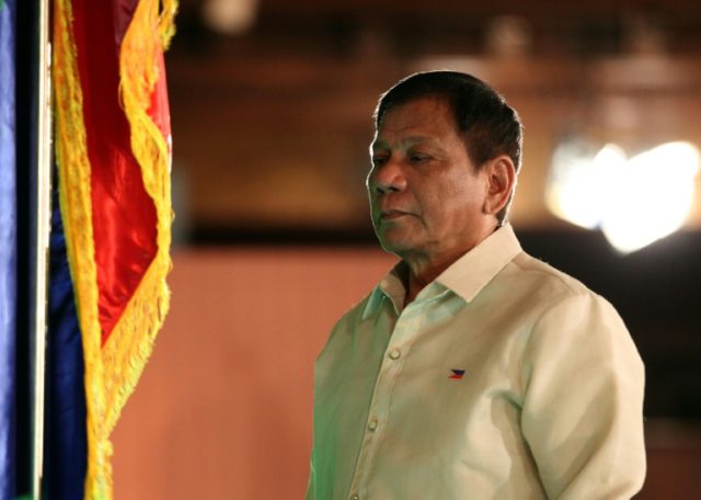 Phillippine President Rodrigo Duterte stands during the swearing-in ceremony at the Malaca