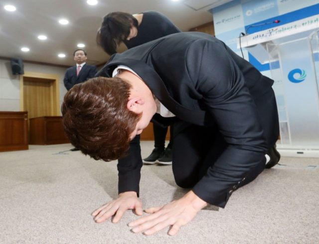 South Korean swimmer Park Tae-Hwan makes a formal deep bow to express his regret for his d