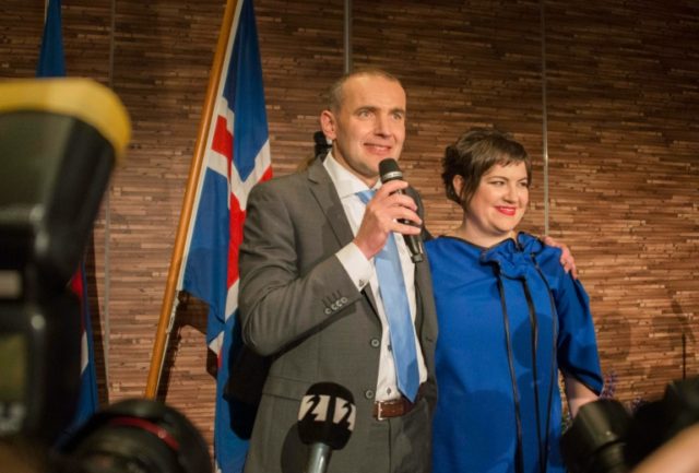 President elect Gudni Johannesson (L) speaks next to his wife Eliza Reid at an election pa