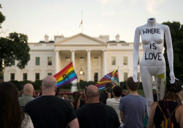 Mourners hold a vigil in outside the White House in Washington, DC on June 12, 2016, in re