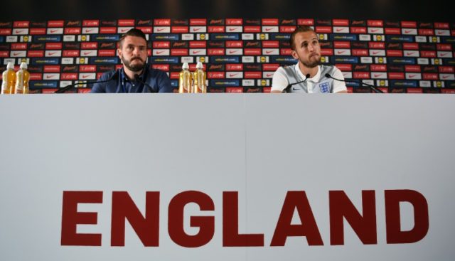 England forward Harry Kane (R) addresses a press conference in Chantilly on June 24, 2016,