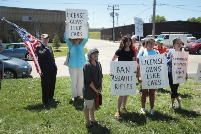Anti-gun demonstrators protest on June 17, 2016 in Lake Barrington, Illinois. House of rep