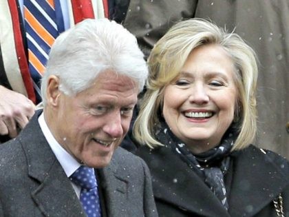 Bill and Hillary Clinton, center, greet people as they exit the funeral for Mario Cuomo at the Church of St. Ignatius Loyola in New York, Tuesday, Jan. 6, 2015. (AP Photo/Seth Wenig)