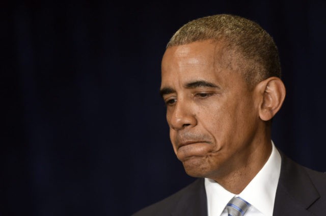 President Barack Obama pauses as he makes a statement on the fatal police shootings of two