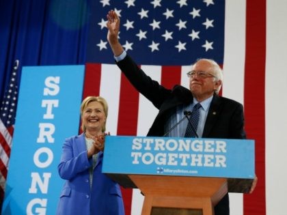 en. Bernie Sanders, I-Vt. waves as he a Democratic presidential candidate Hillary Clinton