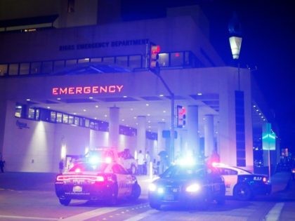 Emergency responder vehicles sit outside of the emergency room at Baylor University Medical Center, Friday, July 8, 2016, in Dallas. (