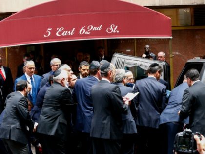 The casket for Nobel laureate and Holocaust survivor Elie Wiesel is placed into a hearst o