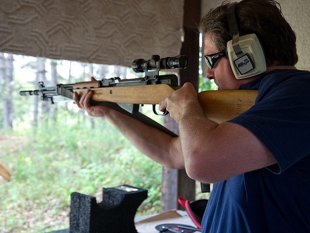 A man fires an SKS semi-automatic rifle June 3, 2012 at the St. Croix Rod and Gun Club in