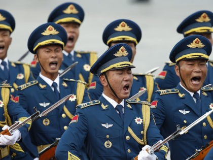 BEIJING, CHINA - SEPTEMBER 14: Honour guard troops march during a welcoming ceremony for Mauritania's President Mohamed Ould Abdel Aziz at the Great Hall of the People on September 14, 2015 in Beijing, China. Invited by President Xi Jinping, Mauritanian President Aziz is on a state visit to China from …