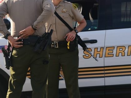 Armed officers from the Sheriff's department on patrol near the scene of the crime in San Bernardino, California on December 2, 2015. A man and a woman suspected of carrying out a deadly shooting at a center for the disabled in California were killed in a shootout with police, while …
