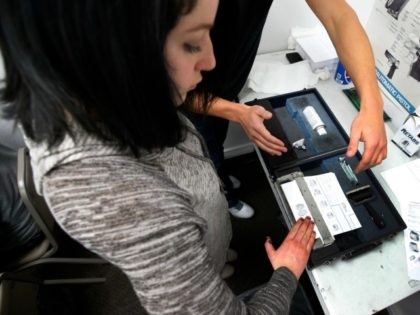 An unidentified person has her fingerprints taken as part of a Utah concealed gun carry permit class, at Range Master of Utah, on January 9, 2016 in Springville, Utah.