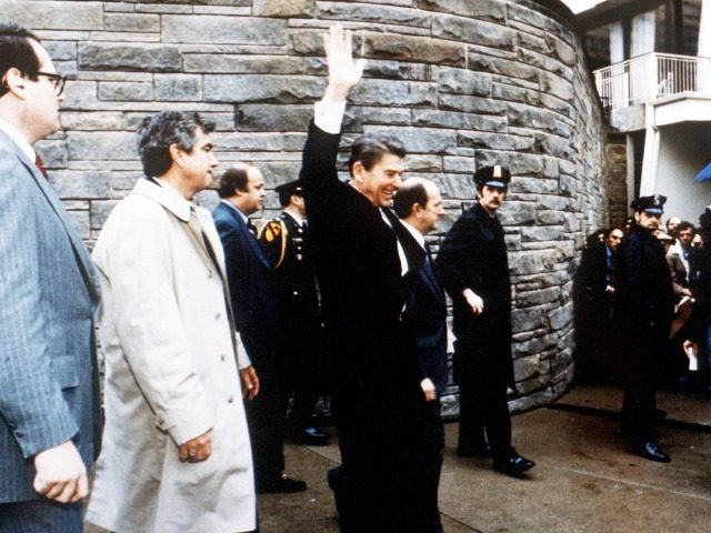 President Ronald Reagan Waves To Onlookers Moments Before An Assassination Attempt By John Hinckley Jr March 30, 1981 By The Washington Hilton In Washington Dc.James Brady Is Visible Third From The Left.