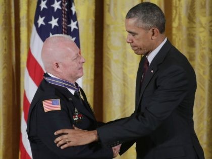 President Barack Obama awards Garland Police Officer Gregory Stevens with the 2014-2015 Public Safety Office Medal of Valor during a ceremony in the East Room of the White House May 16, 2016 in Washington, DC.