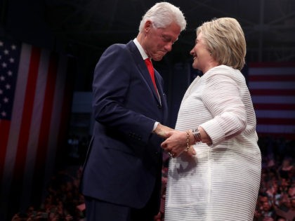 BROOKLYN, NY - JUNE 07: Democratic presidential candidate former Secretary of State Hillary Clinton (R) and her husband former U.S. president Bill Clinton embrace during a primary night event on June 7, 2016 in Brooklyn, New York. Hillary Clinton surpassed the number of delegates needed to become the democratic nominee …