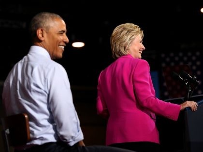 Democratic presidential candidate former Secretary of State Hillary Clinton and U.S. president Barack Obama look on during a campaign rally with on July 5, 2016 in Charlotte, North Carolina.