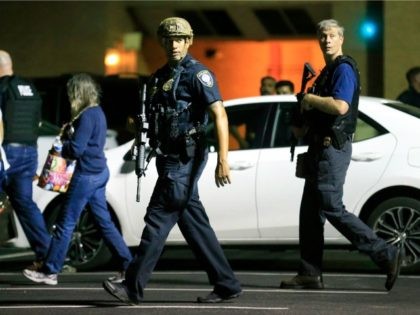 DALLAS, TX - JULY 8: Dallas police escort residents near the scene where four Dallas poli