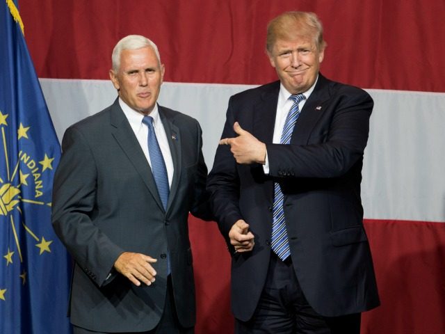Republican presidential candidate Donald Trump (R) and Indiana Governor Mike Pence (L) tak