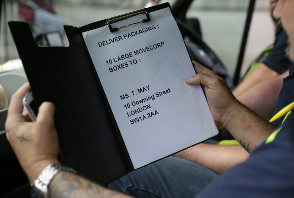 A delivery packaging list featuring the name of the new leader of Britain's Conservative Party and future British Prime Minister Theresa May is pictured in the hands of removal personnel as they arrive at the back of 10 Downing Street in London on July 13, 2016. Theresa May will become Britain's second ever female prime minister on Wednesday July 13, 2016, when David Cameron steps down after a seismic referendum to leave the European Union that sent shockwaves round the world and wrecked his career. / AFP / DANIEL LEAL-OLIVAS (Photo credit should read DANIEL LEAL-OLIVAS/AFP/Getty Images)