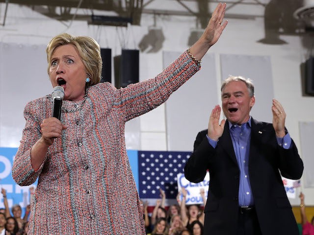 ANNANDALE, VA - JULY 14: Democratic presidential candidate Hillary Clinton (L) speaks as U.S. Sen. Tim Kaine (D-VA) (R) listens during a campaign event at Ernst Community Cultural Center at Northern Virginia Community College July 14, 2016 in Annandale, Virginia. Hillary Clinton continued to campaign for the general election in …