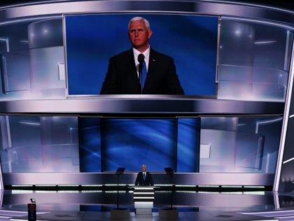 Republican Vice Presidential candidate Mike Pence acknowledges the crowd after delivering