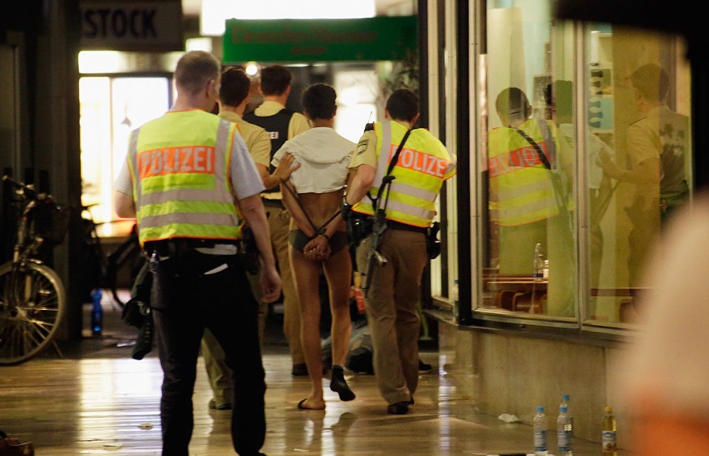 Police arrest three men, whose identities and roles were not yet confirmed, near Marienplatz square on July 22, 2016 in Munich, Germany. During an unfolding terror attack with possibly three shooters and at least eight people confirmed dead Shootings were first reported several hours ago at a Munich shopping mall