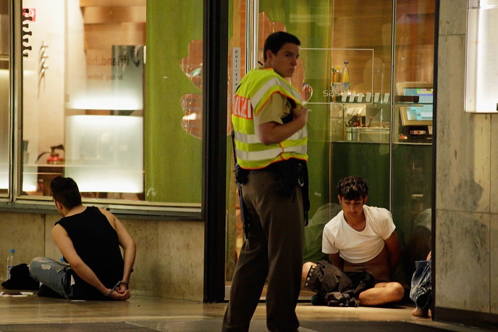 Police arrest three men, whose identities and roles were not yet confirmed, near Marienplatz square on July 22, 2016 in Munich, Germany. During an unfolding terror attack with possibly three shooters and at least eight people confirmed dead Shootings were first reported several hours ago at a Munich shopping mall