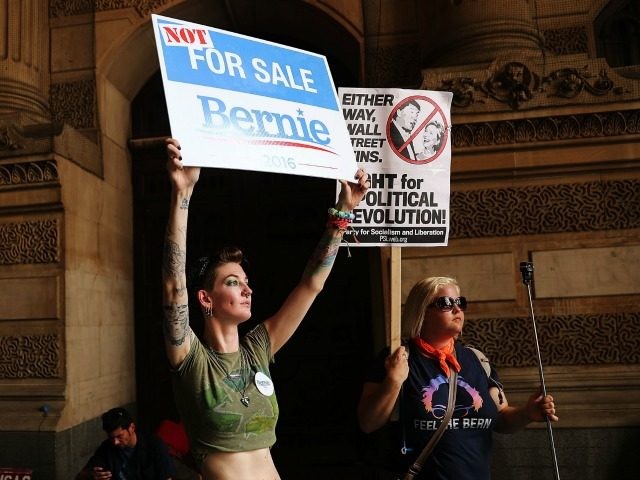 Bernie Sanders supporters prepare to march through downtown on the first day of the Democr