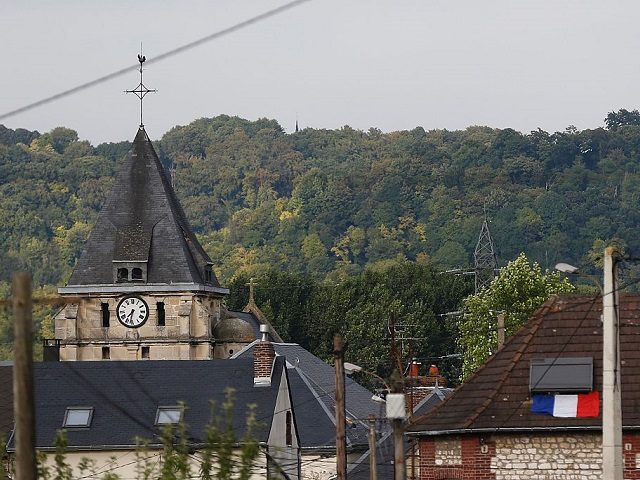 This photo taken on July 26, 2016 shows the steeple of the Saint-Etienne church of Saint-Etienne-du-Rouvray, where a priest was killed earlier today in the latest of a string of attacks against Western targets claimed by or blamed on the Islamic State jihadist group. French President Francois Hollande said that …