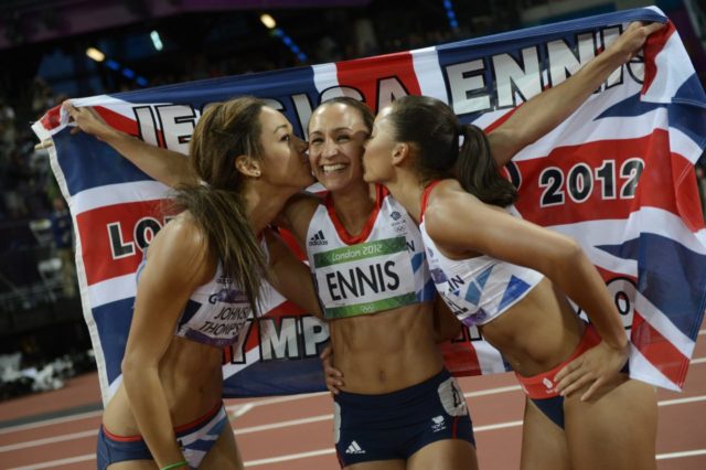 Britain's Jessica Ennis (C) is congratulated by compatriots Katarina Johnson-Thompson (L) and Louise Hazel (R) after winning the women's heptathlon at the athletics event of the London 2012 Olympic Games on August 4, 2012 in London. AFP PHOTO / ADRIAN DENNIS (Photo credit should read ADRIAN DENNIS/AFP/GettyImages)